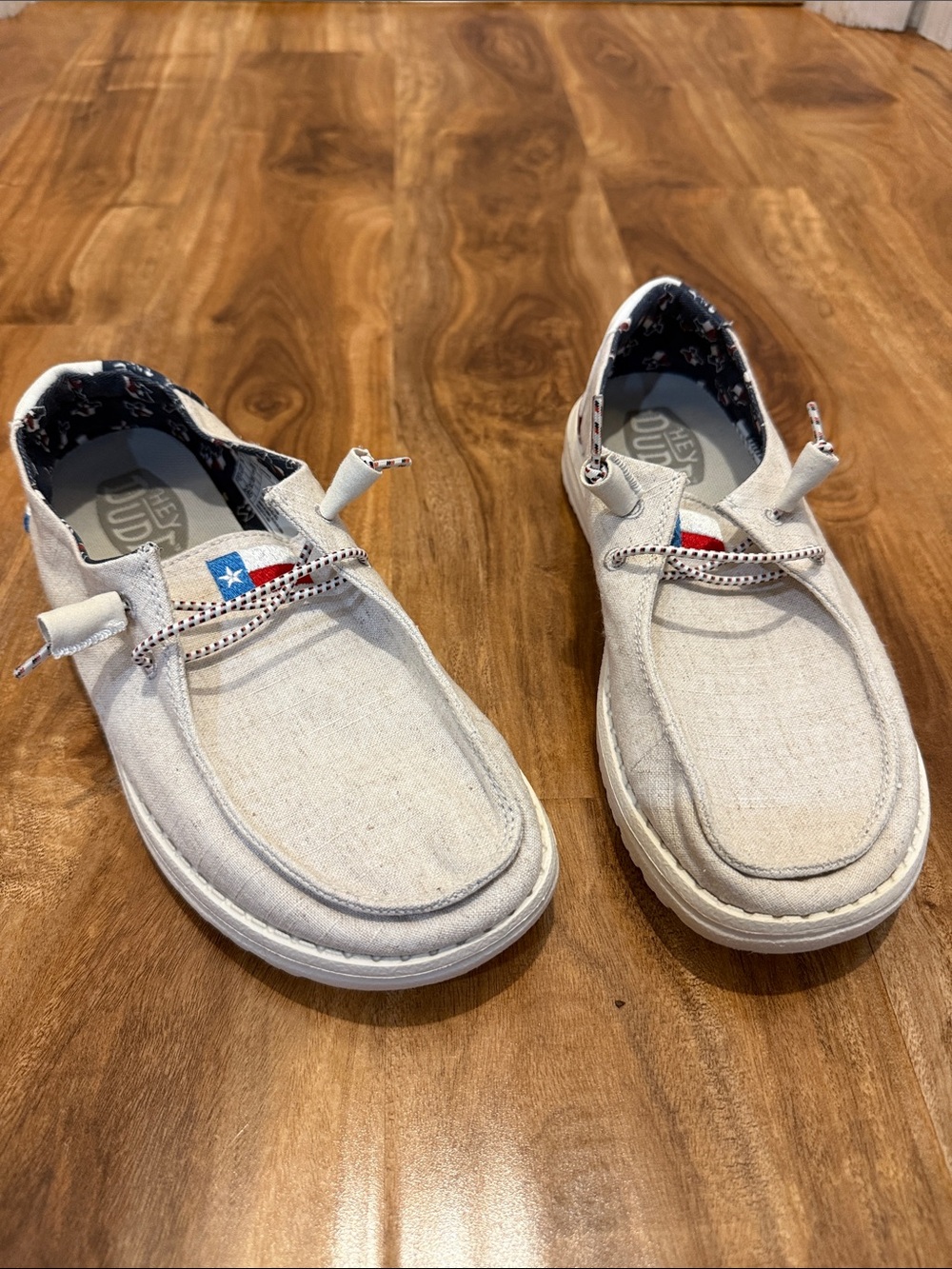 Hey Dude Light Beige Canvas Slip-Ons with Texas Flag Accent